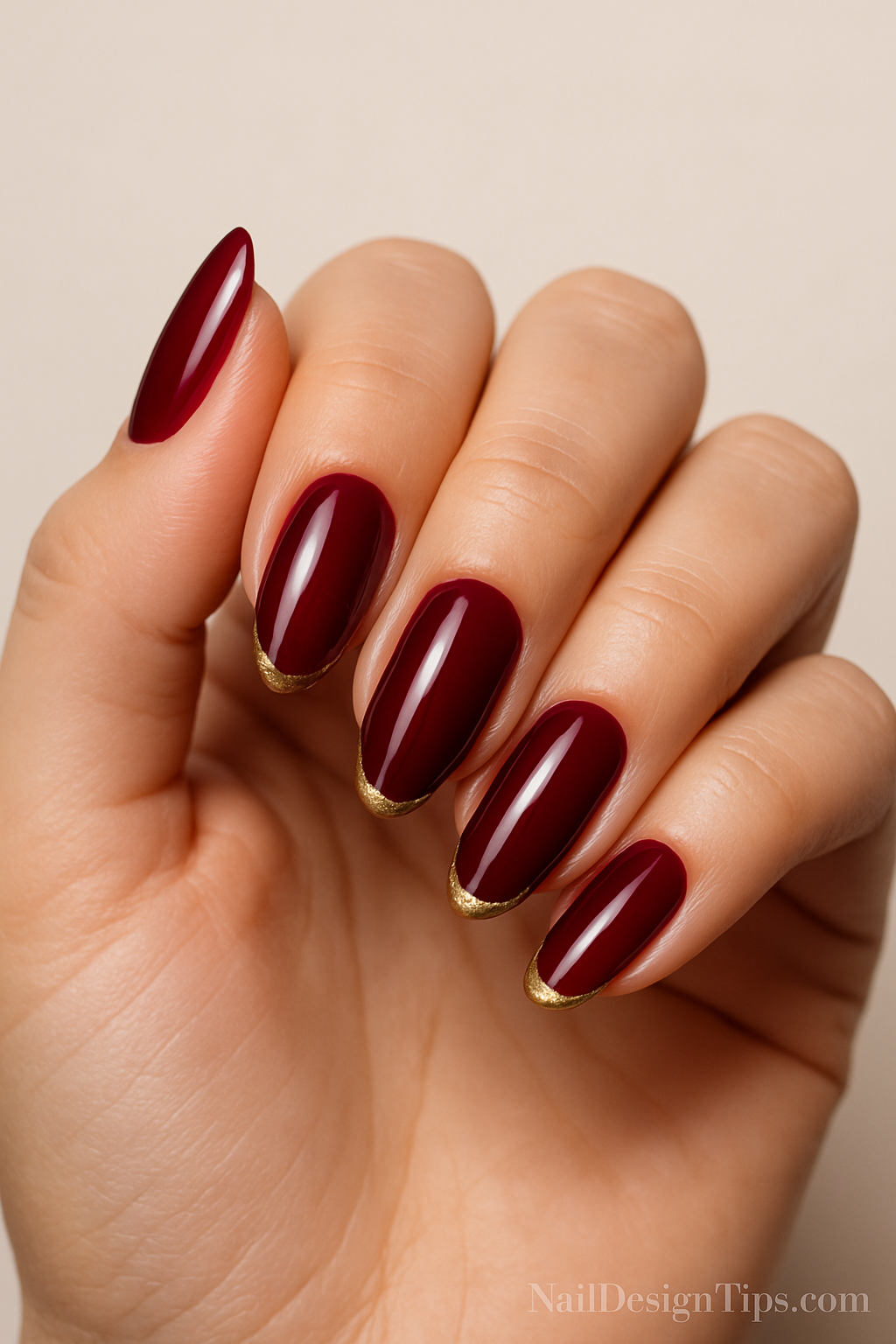 6. Burgundy Glam with Gold Hints